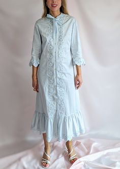 "True vintage 1970s 100% cotton pastel blue midi dress. Nightie style, made of lightweight high quality cotton. Brand Gede, made in Austria. 3/4 sleeve, pussybow neckline detail, openwork floral details, ruffled hems, front button closure. It is a perfect casual dress for the Summer. High quality garment, made to last. Easy maintenance, it can be even machine washed. Flaw free condition, barely any signs of wear and age. Truly adorable. Washed and ready to wear.  Model is size UK 8/ EU 36/ S and Spring Blue Cotton Vintage Dress, Spring Blue Vintage Cotton Dress, Vintage Midi Dress For Daywear In Spring, Spring Prairie Dress Midi Length For Daywear, Spring Midi-length Prairie Dress For Daywear, Spring Cotton Prairie Dress, Midi Length, Spring Cotton Prairie Dress For Daywear, Blue Cottagecore Vintage Dress For Spring, Feminine Cotton Prairie Dress For Spring