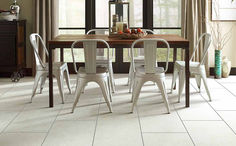 a dining room table with four chairs around it