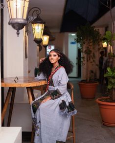 This stunning Habesha dress is made with the finest handwoven Raya fabric, known for its exceptional quality, durability, and intricate designs. The dress features an elegant silhouette that is both feminine and regal, with a flattering fit that accentuates the natural curves of the body. The Raya fabric is expertly woven into intricate patterns and motifs, creating a mesmerizing effect that is both delicate and bold. The raya dress is adorned with delicate embroidery and beading, adding a touch Traditional Ceremony Dresses With Woven Motifs, Elegant Handloom Dress For Eid, Long Dresses With Woven Motifs, Traditional Cotton Midi Dress, Raya Dress, Habesha Dress, Habesha Kemis, Delicate Embroidery, Natural Curves