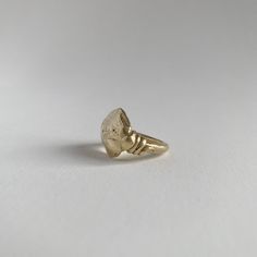 This shape is cast from a rock I found on the beaches of the Pacific Coast. The roundness and irregular shape envelop all the beauty that nature provides. Depending on casting, each rock will look completely unique with its own markings and character. Along the side of the ring, are hand-formed serpents. COMPOSITION 18K Recycled Gold 4 or 6 Ring Size Alternate sizes available upon request Elegant Rings With Raw Stone, Round Shape, Round Raw Stone Promise Rings, Raw Stone Promise Ring, Gold Jewelry With Raw Stone For Promise Ring, Untreated Recycled Gold Jewelry As A Gift, Untreated Recycled Gold Jewelry Gift, Recycled Gold Untreated Jewelry As A Gift, Hand Forged Recycled Gold Open Ring, Hand Forged Open Ring In Recycled Gold