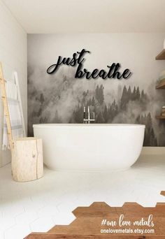 a bathroom with a white tub sitting next to a wooden shelf