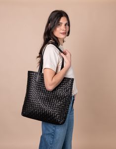 Model with Georgia bag in black woven classic leather Woven Leather Bag, My Bags, Sustainable Leather, Olivia Black, Small Village, Leather Weaving, Beach Picnic, Classic Leather, Kolkata