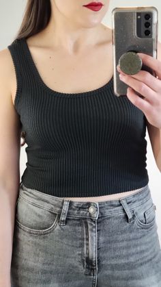 Details: You will love this two tone black and charcoal ribbed scoop neck tank top! Soft stretchy material and a good length for a crop top. So versatile! Pair with your favorite high waisted pants. Materials: 72% Polyester, 23% Rayon, 5% Spandex Made In: USA Sizing Tip: Order True to Size. If in between sizes then size up. I am about 5'7 165 pounds and a 34B, and I am generally a S/M top, and I am wearing the medium. Scoop Neck Tank Top, Crop Tank Top, Black Rib, Cropped Tank Top, Crop Tank, High Waisted Pants, Stretchy Material, Two Tone, Made In Usa