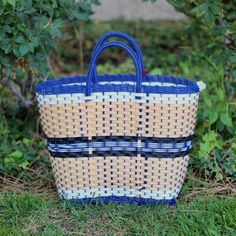 Made from handwoven plastic by Valentin Ortega from Acambay, Mexico. Each one is made individually with love and care. Use this reusable and eco-friendly tote bag as a shopping bag for farmer's markets, great for the pool or the beach.Details: * Tote measurements: 12 W ( lower part) 17” W (top) 12.5 High. * Waterproof-washable * Material: Recycle Plastic * All items are shipped from the USAll Mi Mundo Mexicano items are 100% handmade by artisans in Mexico. Each stitch and item is completely uniq Traditional Woven Shopping Bags, Mexican Market Bag, Eco-friendly Blue Handwoven Straw Bag, Eco-friendly Multicolor Straw Bag For Beach, Mexican Plastic Woven Bags, Beach Details, Mexican Beach, Mexican Beaches, Colour Star