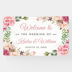 a welcome sign with pink flowers and greenery on the bottom, in front of a white background