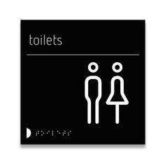 a black and white sign with the words toilets on it's side, next to an image of a man and woman