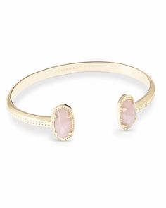 A dainty pinch cuff bookended with our signature oval stones, the Elton Gold Cuff Bracelet in Rose Quartz is a stack staple. This beautifully designed gold cuff bracelet is guaranteed to turn heads every time you wear it. No matter the size of your wrist, our Elton Cuff Bracelet is sure to fit you and your style. Kendra Scott Bracelet, Gold Cuff Bracelet, Rose Quartz Jewelry, Rose Gold Quartz, Gold Bracelet Cuff, Quartz Jewelry, Gold Cuffs, Jewelry Lookbook, Kendra Scott Jewelry