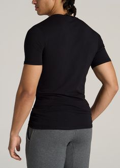 About Our Men's Tall T-Shirt Essential is an understatement. Good quality tall men's shirts are hard to come by, but this one offers the perfect blend of comfort, versatility and durability. We designed this tee to be an everyday basic that you'll want in every color. It's perfectly tailored for tall guys between 6'3” and 7'1”, with an extra-long length that you won't have to worry about pulling down and short sleeves that are proportional to your arms. The slim-fit is super flattering on your f Essentials Crewneck, Tall Men, Men In Black, Tall Clothing, Mens Essentials, Fleece Joggers, Men's Shirts, Tall Guys, Black T Shirt