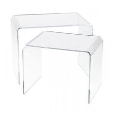 two clear acrylic tables sitting next to each other on a white background,