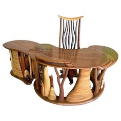 a wooden table with two chairs and an oval dining room table made out of wood