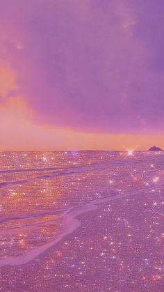 the sky is purple and there are stars in the water on the beach at sunset