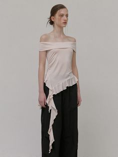 This product is an off-shoulder t-shirt that combines elegance with a casual edge. Featuring a frilled hemline that adds a touch of playfulness, this top provides a stylish option for those who appreciate modern design with a feminine twist. - This off-shoulder t-shirt is designed with a delicate frill detail that enhances its chic appeal.- The clean lines and smooth fabric offer a sleek and comfortable fit for a variety of occasions.- It integrates a contemporary aesthetic with a hint of romance, suitable for both daytime and evening wear.- A statement piece in itself, this top requires minimal accessories to create an impactful outfit. Spring Off-shoulder T-shirt, Camille Dress, Off Shoulder T Shirt, Minimal Accessories, Off Shoulder Shirt, Fashion Sites, Sewing Design, Work Inspiration, Contemporary Aesthetic