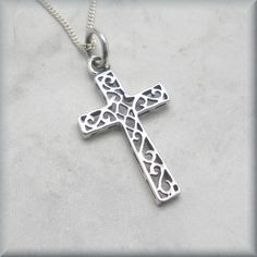 "A lovely sterling silver cross has the added interest of a scrollwork pattern added to the center sections. Wonderful for everyday wear for someone who wants a necklace of faith. The pendant is 1\" long (2.54 cm). The bail adds about 1/4\" more in length. Both pendant and curb chain are sterling silver. Items are shown larger in pictures to show detail - please note the dimensions. Jewelry is packaged in a cotton lined box for gift-giving. See more Bonny Jewelry at http://bonnyjewelry.etsy.com Sterling Silver Cross Pendant For First Communion, Sterling Silver Cross Pendant Necklace For First Communion, Sterling Silver Cross Necklace For First Communion, Silver Cross Pendant Jewelry For Baptism, Silver Cross Jewelry For Confirmation, Silver Spiritual Jewelry For Baptism, Silver Crucifix Necklace For Baptism, Silver Cross Necklace For Confirmation, Sterling Silver Cross Necklace For Baptism