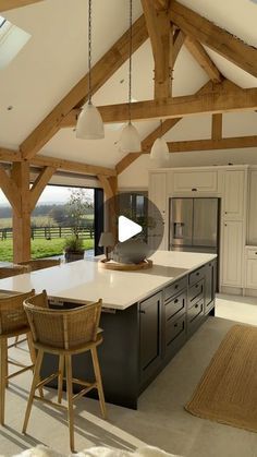 a large kitchen with an island in the middle