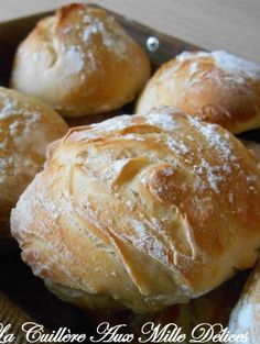 some bread rolls are sitting in a bowl