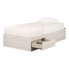 a white bed with two drawers underneath it