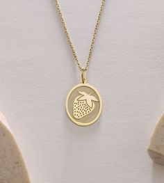 Gold Strawberry Pendant - Strawberry Gold Necklace ● Material of pendant: Solid Gold 14k ( REAL GOLD ) ● Metal Stamp: 14k ( REAL GOLD ) ● The pendant is available in 5 sizes: - 12x17 mm / 0,47 x 0,66 inches - 13x18 mm / 0,51 x 0,70 inches  In the photos - 14x19 mm / 0,55 x 0,74 inches  - 16x21 mm / 0,62 x 0,82 inches  - 18x24 mm / 0,70 x 0,94 inches ( In the photos the size is 13x18 mm / 0,51 x 0,70 inches ) ( Jump Ring inner diameter: 4 mm ) ● Material of chain: Solid gold 14k ( REAL GOLD ) It is thin and dainty and it is available in 4 sizes: - 40 cm / 15,75 inches ( Length ) - 45 cm / 17,72 inches ( Length ) In the photos - 50 cm / 19,68 inches ( Length ) - 55 cm / 21,65 inches ( Length ) ● Backside engraving is FREE ( Please use the personalization box for that.) ● If you want larger s Yellow Gold Charm Necklace For Birthday And Valentine's Day, Classic Oval Charm Necklaces, Personalized Oval Yellow Gold Charm Necklace, Gold Tarnish Resistant Necklace For Birthday, Yellow Gold Oval Pendant Jewelry Gift, Fine Jewelry Pendant Necklace For Birthday, 14k Gold Oval Pendant Jewelry Gift, Yellow Gold Oval Charm Necklace Gift, Yellow Gold Oval Charm Necklace As Gift