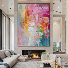 a living room filled with furniture and a large painting hanging on the wall over a fire place