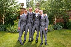 a group of men in suits standing next to each other