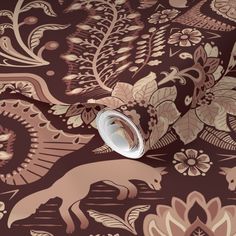 an intricately designed wallpaper with flowers and animals on it's side,