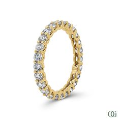 This elegant eternity band has a stunning total weight of 1.40 CTW. With its classic and timeless design, this band is perfect for any occasion and can be passed down for generations. Expertly crafted with high-quality materials, this band will add a touch of sophistication to any jewelry collection. Classic Cubic Zirconia Eternity Band With Halo, Classic Yellow Gold Eternity Band, Classic Oval Yellow Gold Eternity Band, Yellow Gold Eternity Band With Halo Design, Classic Eternity Band With Prong Setting, Classic Yellow Gold Cubic Zirconia Eternity Band, Classic Eternity Band With Halo Design, Classic Yellow Gold Eternity Band With Round Cut, Classic Yellow Gold Eternity Band With Prong Setting