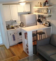 the small kitchen is clean and ready to be used as a living room or office