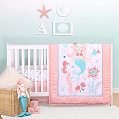 a baby's room with a pink and blue theme