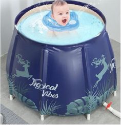 a baby swimming in an inflatable pool