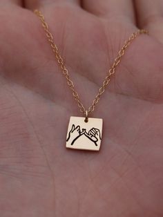 "Copy and paste into your browser, get 15% off ➔ https://bit.ly/VD15OFF Looking for the perfect piece of everyday gold jewelry? The pinky swear gold filled necklace, for couples, best friends, or siblings living apart, or even as a going away gift. This necklace makes great friendship necklaces and offering a great birthday gift for your best friend. Featuring two hands with intertwined pinkies representing a pinky swear, this necklace demonstrates a pact made between you and your loved ones. DETAILS: -One necklace -10mm Gold Filled Square Charm -Gold Filled chain in the length of your choice -Spring ring clasp You will receive one gold filled charm necklace, in the length of your choice. **Every item is handmade, this means that each will be unique and may not look EXACTLY like the pictur Personalized Pendant Charm Necklaces For Party, Personalized Pendant Charm Necklace For Party, Nickel-free Gold Jewelry For Best Friend Gift, Customizable Gold Jewelry For Best Friend Gift, Nickel-free Gold Jewelry For Birthday Gift, Customizable Jewelry For Valentine's Day Party, Meaningful Gold Jewelry For Birthday Gift, Gold Jewelry For Best Friend Gift, Gold Jewelry For Best Friend's Gift