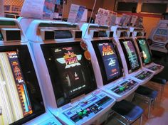 several slot machines are lined up in a row and ready to play the video game