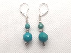 Hand made in USA by our own artisan. Metal: Sterling Silver Stone: Green Howlite Turquoise Legth: 1.5 inches Clasp: Lever back, 925 stamped Item SKU: lomESS2SGnTurq Brand:Ruby Mode Our "Grape pyramid" earrings with Green Howlite Turquoise balls. They feature a 10 mm faceted ball and 6 mm  ball of Green Howlite Turquoise. Pyramids on the bottoms and center beads are made in Bali, Indonesia, from Sterling Silver. Lever back clasp with a "925" stamp and special wrapping. Hand made right here in California by our resident artist  Our master artisan comes from Europe. She crochets clothing items to make you feel comfortable and warm in cold weather.  Her original pattern ideas for scarves come from native European ornaments, featuring simple elegance and mystery. She takes pride in the quality Turquoise Gemstone Earrings With Round Beads, Adjustable Turquoise Faceted Jewelry, Adjustable Faceted Turquoise Jewelry, Turquoise Faceted Bohemian Jewelry, Pyramid Earrings, Pattern Ideas, Turquoise Howlite, Made Clothing, Best Wear