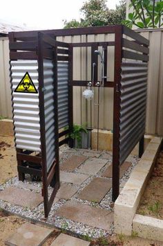 an outdoor shower made out of shipping containers