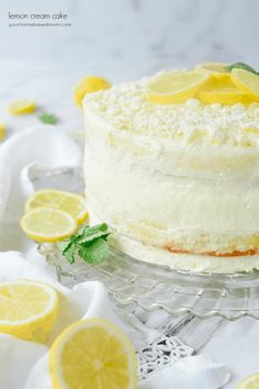 there is a cake with lemons on the table