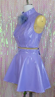 Glossy pastel cuteness! This crop top and skater skirt set is made from lilac pvc with removable pom-pom powder puff and bow details!! The top zips open all the way up the front to get into it, the skirt has a small zip in the back. Sizing is as follows: TOP XS - UK 8 - bust 33", bottom of ribs 27" S - UK 10 - bust 34", bottom of ribs 29" M - UK 12 - bust 36", bottom of ribs 31" L - UK 14 - bust 38", bottom of ribs 33" XL UK 16 - bust 40", bottom of ribs 35" There is a bit of stretch to the pvc Showgirl Outfit, Plastic Outfit, Plastic Clothes, Pvc Fabric, Purple Outfits, Buy Buy, Top Cropped, Pastel Purple, Powder Puff