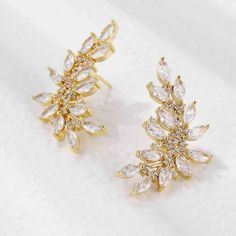 Introducing New Earrings “Ella” Cubic Zirconia Leaf Stud Brand : Sana Officials Insta : Sana_.Officials Based In Ny Deliver All Over Us Elegant Gold Crystal Earrings With Prong Setting, Gold Bridal Earrings With Sparkling Cubic Zirconia, Gold Diamond Earrings With Prong Setting For Party, Elegant Gold Plated Earrings With Rhinestones, Gold Bridal Earrings With Prong Setting For Party, Gold Bridal Earrings With Rhinestones, Gold Cubic Zirconia Sparkling Diamond Earrings, Gold Crystal Earrings With Prong Setting For Party, New Earrings