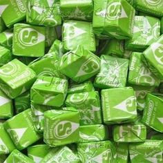 green and white candy cubes stacked on top of each other