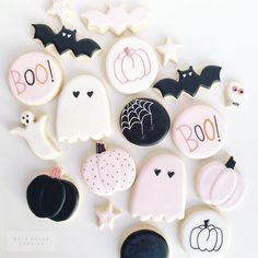 decorated cookies are arranged in the shape of ghost, bat, pumpkins and bats