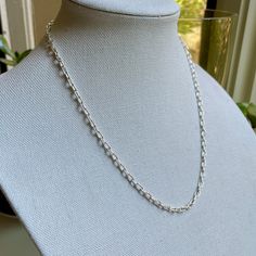 Are you looking for a timeless statement necklace for someone special? Do you need a sturdy sterling silver chain for a special pendant? This simple yet elegant handcrafted oval chain will last forever and would make the perfect gift. And it costs a fraction of silver chains that come in a blue box and a bow! Here are the details: This beautiful necklace starts off as sterling silver wire and a clasp and was transformed into a tiny oval link chain...each link measuring about 3mm x 6mm and the completed length is about 21 inches long. All of the links were individually formed, cut and soldered - which is tricky with links this small! This item was handmade by Will Macy in Corvallis, OR. This item is ready to ship. If you need a different length, please message us and we can make any length Modern Jewelry With Rolo Chain And Oval Links, Classic Sterling Silver Chain Necklace For Everyday, Timeless Rolo Chain Necklace As Gift, Timeless Rolo Chain Necklace For Gifts, Timeless Rolo Chain Necklace Gift, Classic Everyday Sterling Silver Chain Necklace, Everyday Classic Sterling Silver Chain Necklace, Silver Oval Pendant Necklace With Cable Chain, Silver Oval Link Chain Necklace As Gift