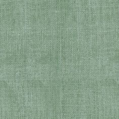 a green fabric textured with small squares