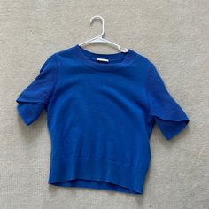 Very Chic And Comfortable Blue Sweater From Cos Size: Not Listed But Fits Medium Or Large. Brand: Cos Condition: Perfect Condition. Only Worn A Couple Of Times, And There Are No Damages Or Tears, The Sweater Almost Looks Brand New. Blue Crew Neck Sweater For Work, Casual Blue Short Sleeve Sweater, Blue Short Sleeve Casual Sweater, Blue Knit Sweater With Short Sleeves, Blue Short Sleeve Winter Sweater, Blue Fitted Short Sleeve Sweater, Blue Knit Short Sleeve Sweater, Blue Short Sleeve Knit Sweater, Oversized Blue Cotton Sweater