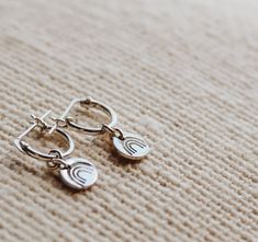 Little details make life special. The “blink and you’ll miss it” aspects of our lives are often the ones that impact us the most. Your most cherished moments and personality traits are what make you beautiful. -10mm hoop earrings -6mm charms -sterling silver or gold filled -choose design for charms (can be two different designs or two of the same) Sterling Silver Dangle Huggie Earrings Hypoallergenic, Sterling Silver Dangle Huggie Earrings, Hypoallergenic Sterling Silver Dangle Huggie Earrings, Minimalist Personalized Sterling Silver Charms, Personalized Minimalist Sterling Silver Charms, Nickel-free Silver Dangle Huggie Earrings, Silver Nickel-free Dangle Huggie Earrings, Gift Sterling Silver Huggie Earrings, Silver Dangle Huggie Earrings Nickel-free