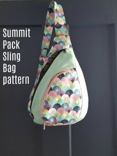 a bag hanging on a wall with the words summer pack sling bag pattern below it