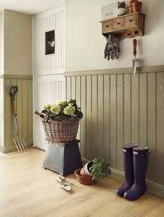 an image of a room with flowers and gardening tools on the floor in front of it