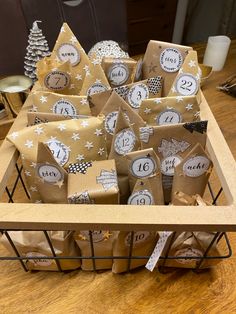 brown paper bags with white stars and numbers on them are sitting in a wire basket