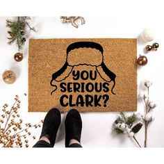 a door mat that says, you serious clark? with a man's face on it