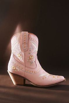 Botanical embroidery dances across these playful Western-inspired boots, finished with a low heel and an almond toe for effortless comfort. Western Cowgirl Boots, Short Cowboy Boots, Quinceañera Ideas, Country Backgrounds, Pink Cowgirl Boots, Feather Heels, Botanical Embroidery, Cowboy Shoes, Dance Heels