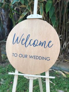 a wooden sign that says welcome to our wedding