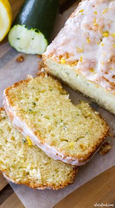 two slices of lemon zucchini bread sitting on top of a piece of wax paper