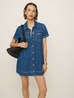 Denim time. Shop the Harlee Denim Mini Dress from Reformation, a mini-length dress with a collared neckline, button front, and short sleeves. Dark Denim Dress Outfit, Denim Babydoll Dress, Relaxed Fit Mini Denim Dress, Trendy Mini-length Denim Dress, Denim Dress Vintage, Reformation Denim Dress, Short Denim Dress, Blue A-line Denim Mini Dress, Mini Denim Dress