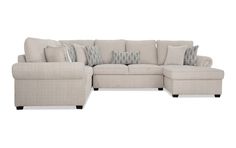 a sectional couch with pillows on it